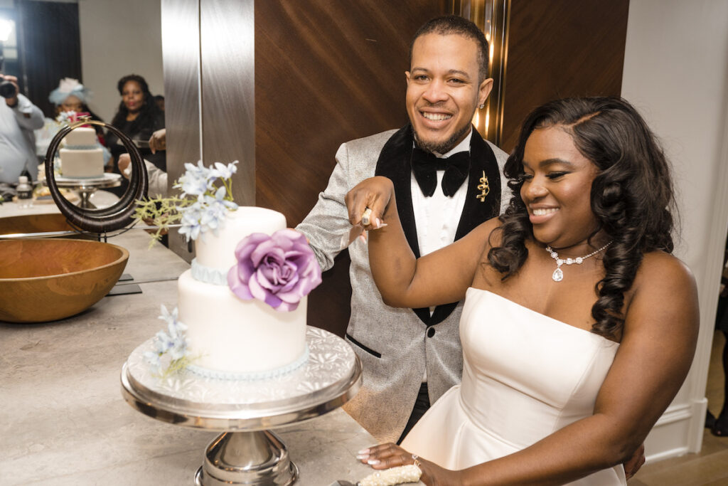 Bride and groom cutting the cake in culture fusion micro wedding.