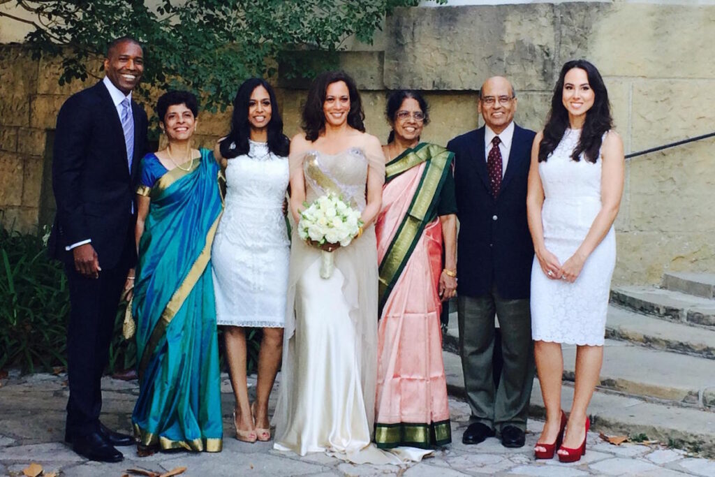 Doug Emhoff and Kamala Harris's Courthouse Wedding (Kamala posing with family in wedding dress).