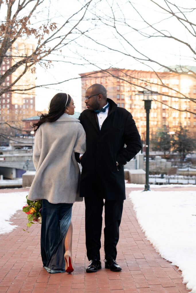 Engaged couple posing in downtown Providence, Rhode Island in their elegant winter engagement photo session.