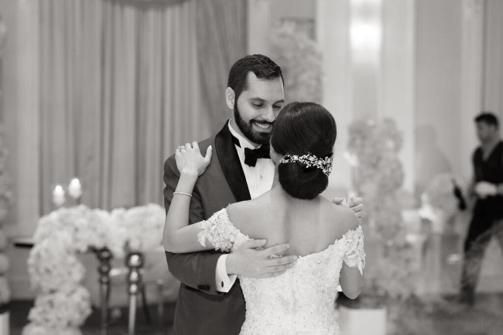 Bride and Groom slow dancing at their classic luxurious wedding.