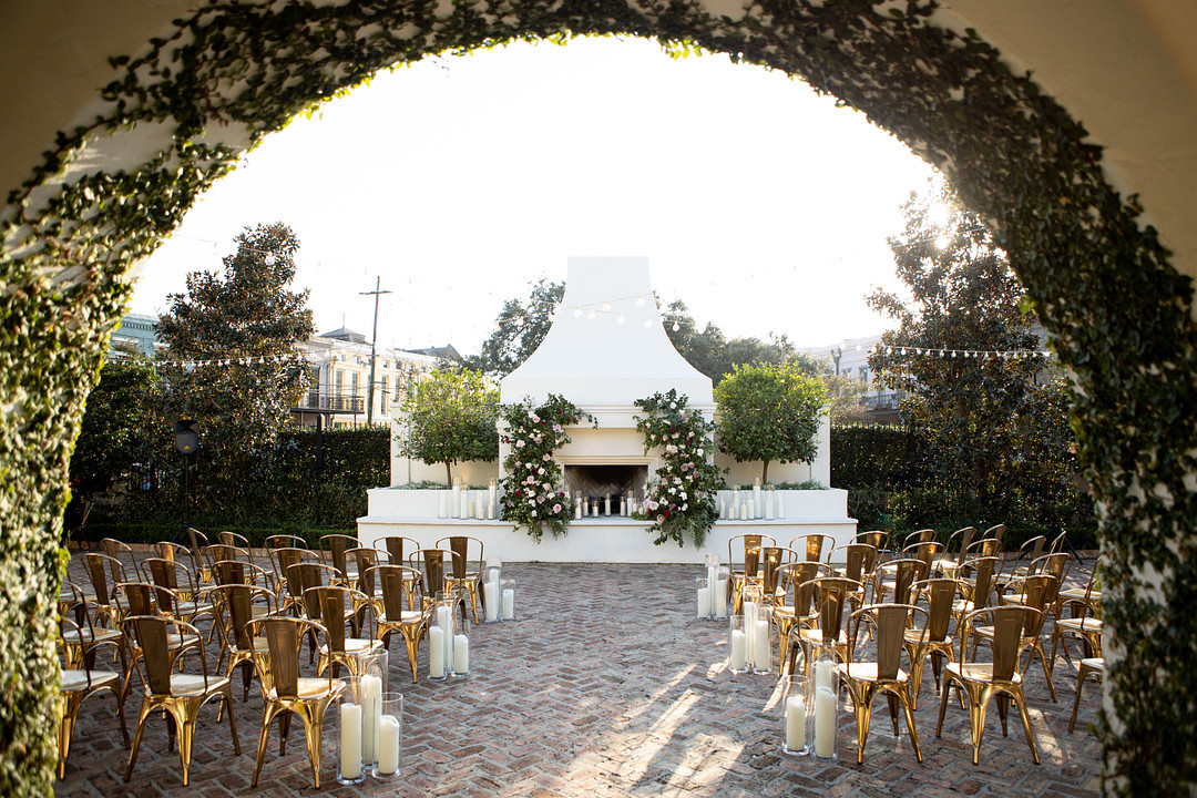 Soft flickering candles and cascading florals are just a few details from this intimate and romantic wedding at the Il Mercato New Orleans.