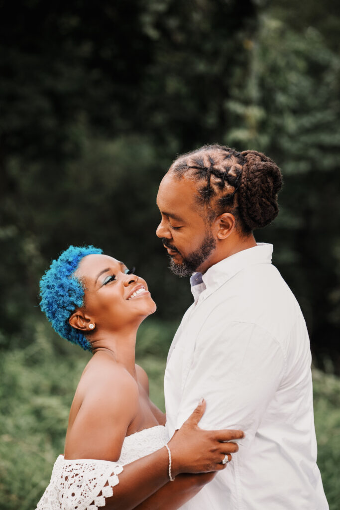 This black excellence-inspired engagement shoot at Great Falls National Park has 3 sexy outfits & blue-dyed natural hair for the bride-to-be.