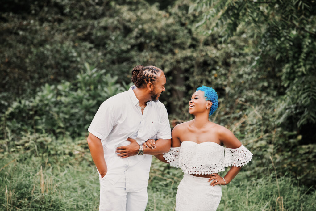 This black excellence-inspired engagement shoot at Great Falls National Park has 3 sexy outfits & blue-dyed natural hair for the bride-to-be.