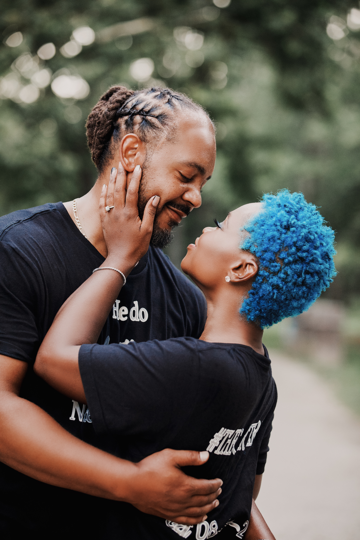 This black excellence-inspired engagement shoot at Great Falls National Park has 3 sexy outfits & blue-dyed natural hair for the bride-to-be.