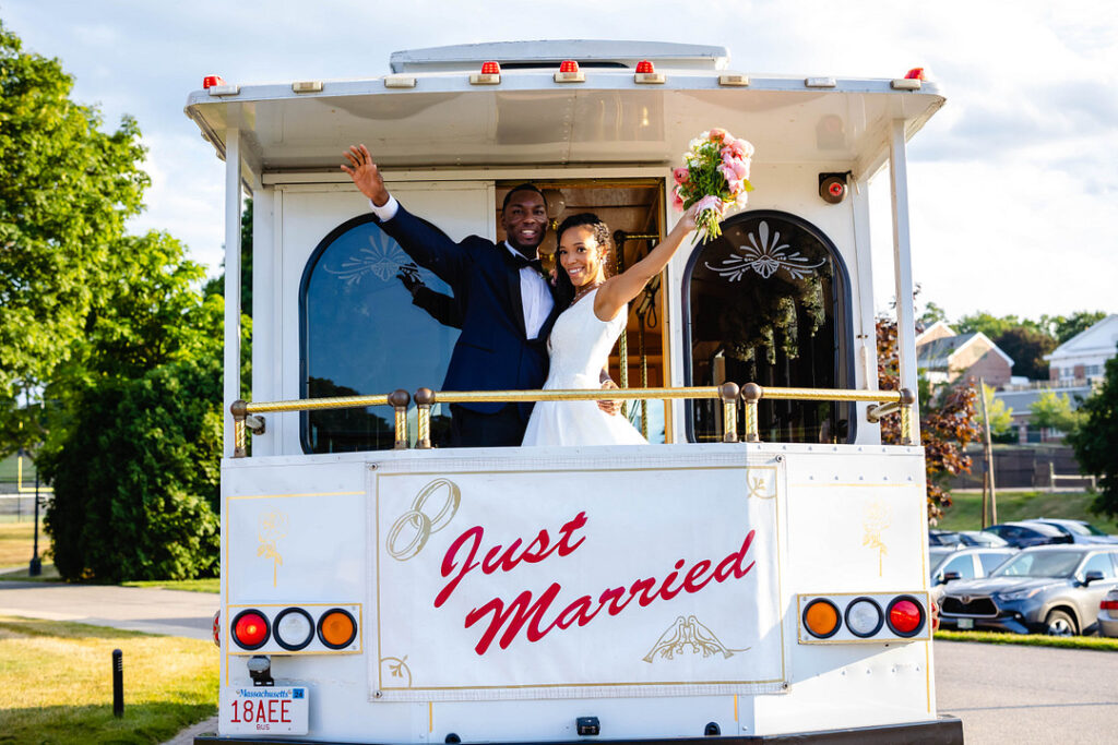 Green pastures, bright florals, a classic red barn, and two glam gowns are highlights of this chic barn wedding in Boston.