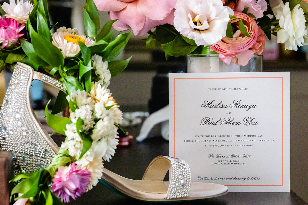 Green pastures, bright florals, a classic red barn, and two glam gowns are highlights of this chic barn wedding in Boston.