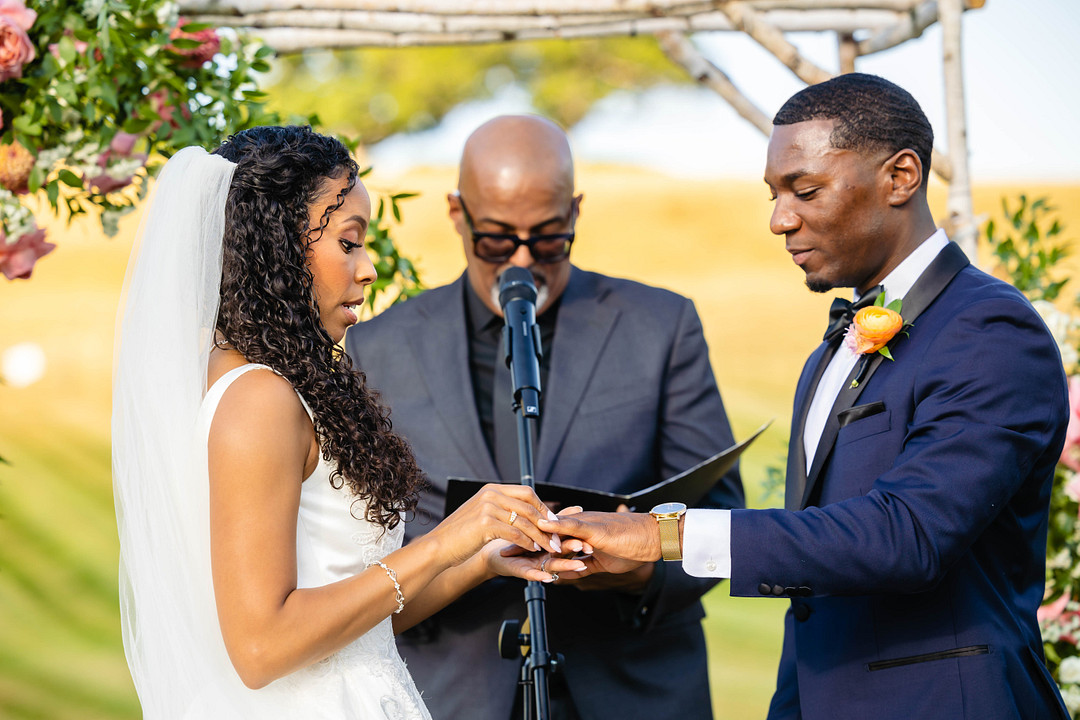 Green pastures, bright florals, a classic red barn, and two glam gowns are highlights of this chic barn wedding in Boston.