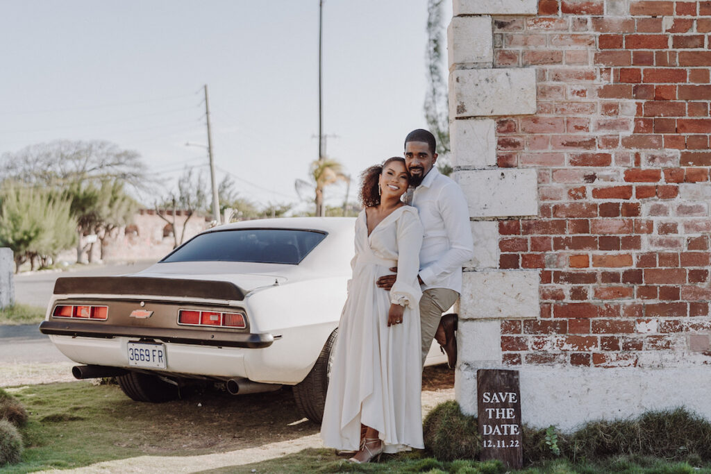 Vintage Engagement session in Port Royal, Kingston, Jamaica, features classic 1969 Camaro Chevy, pastel florals, and a historic venue.