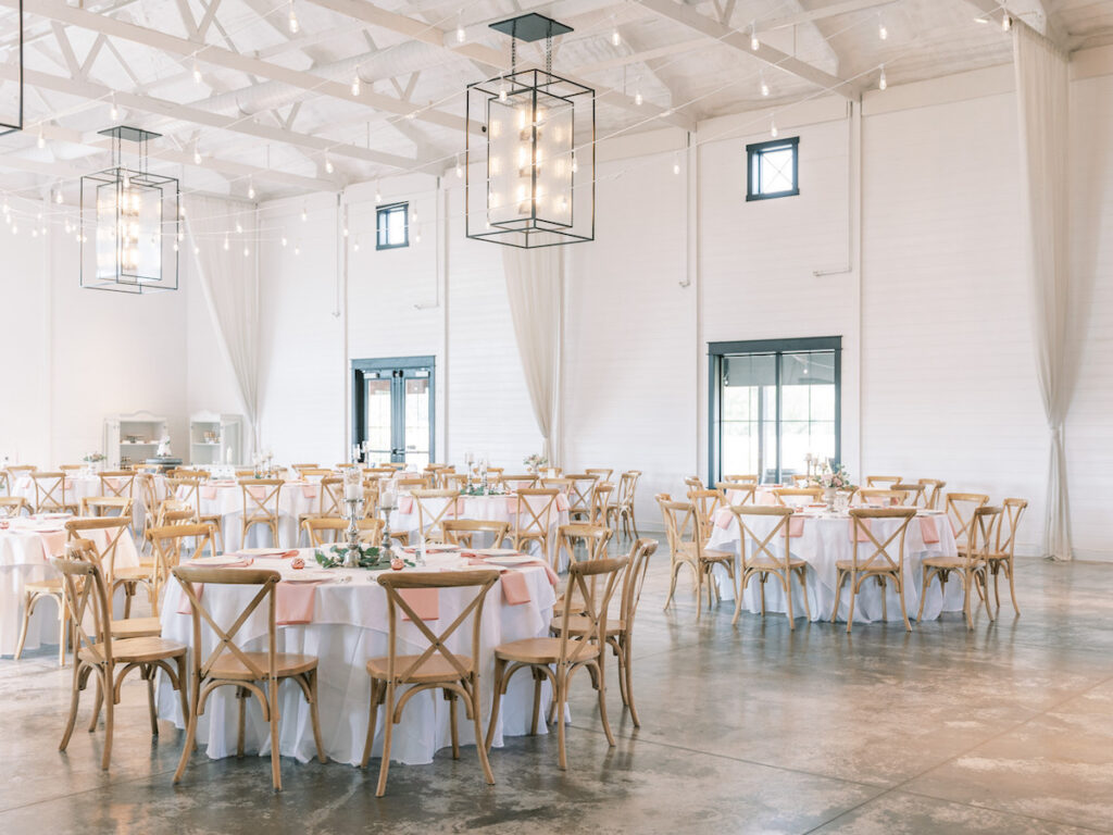 Pastel pink and mauve hues, a sleek modern gown, and a rustic chic venue at Ashton Hill Farm are just a few details from this adorable wedding in Iowa.