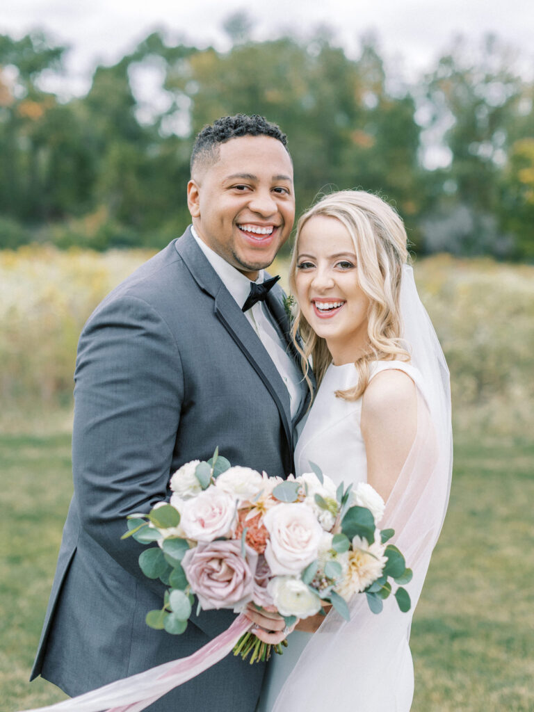 Pastel pink and mauve hues, a sleek modern gown, and a rustic chic venue at Ashton Hill Farm are just a few details from this adorable wedding in Iowa.