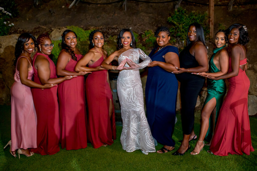 This hilltop vineyard wedding in Malibu is everything sweet with a sunset-inspired color story, an outdoor ceremony, and two glam dresses!