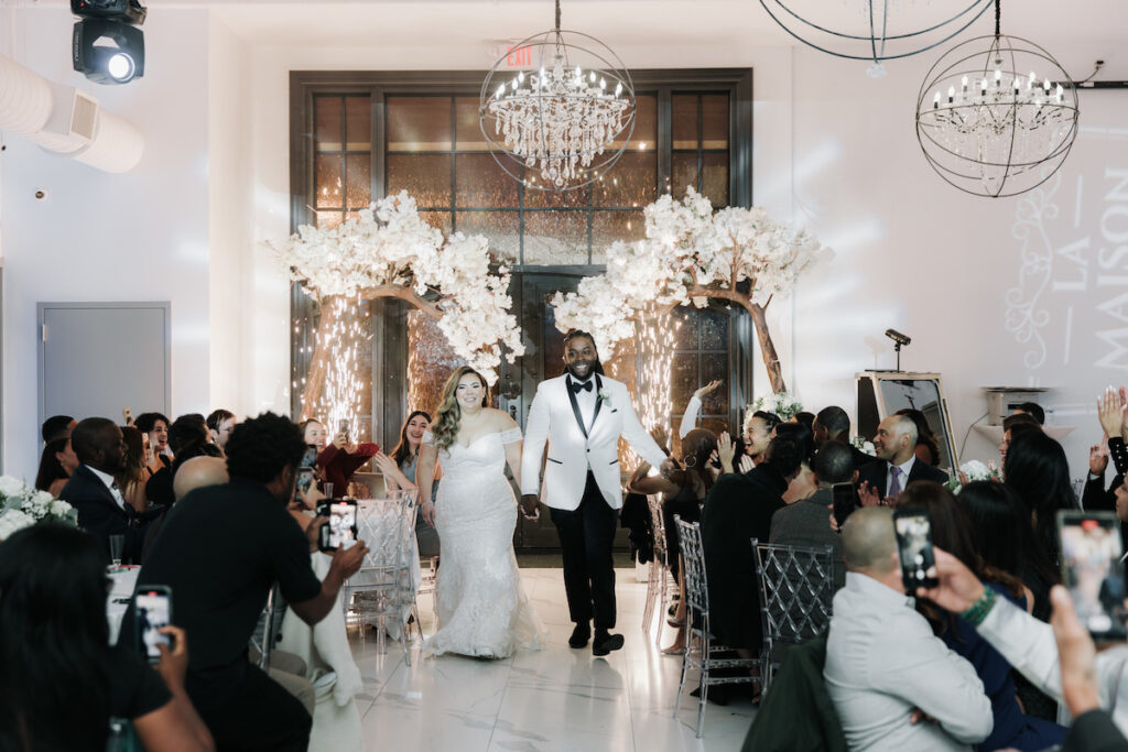 Alma & Khurram's wedding at La Maison in Belleville, NJ, was a celebration of Dominican and Jamaican culture with lux decor including a flower and candle wall, gorgeous centerpieces, and classy furniture with gold details.