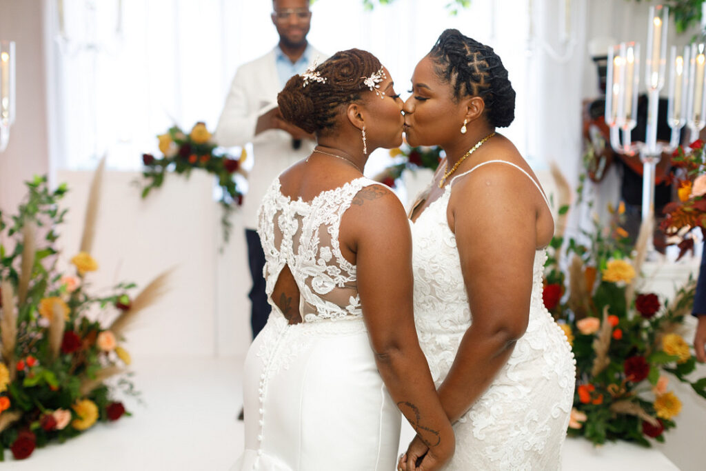 Couple celebrates their love in a colorful jewel-tone wedding at Your Signature Hall & Events in Charleston, South Carolina.