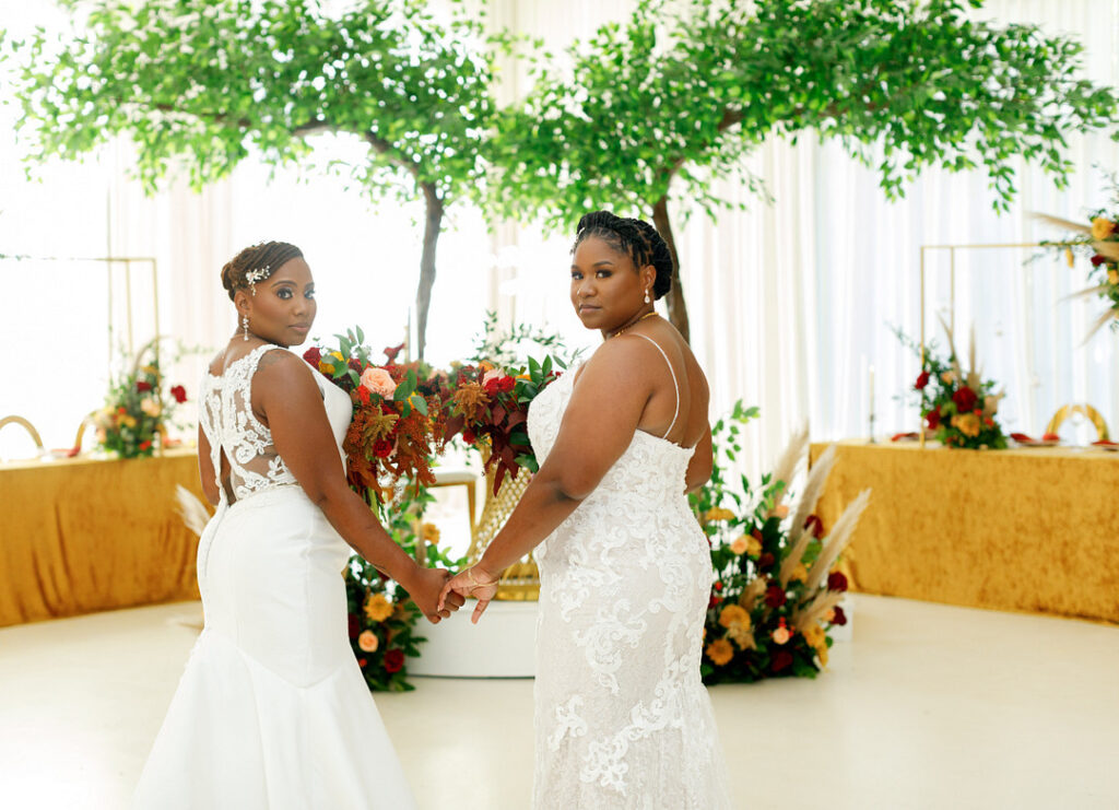 Couple celebrates their love in a colorful jewel-tone wedding at Your Signature Hall & Events in Charleston, South Carolina.