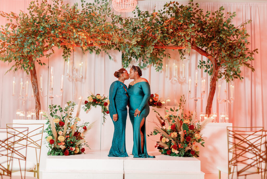 Couple celebrates their love in a colorful jewel-tone wedding at Your Signature Hall & Events in Charleston, South Carolina.