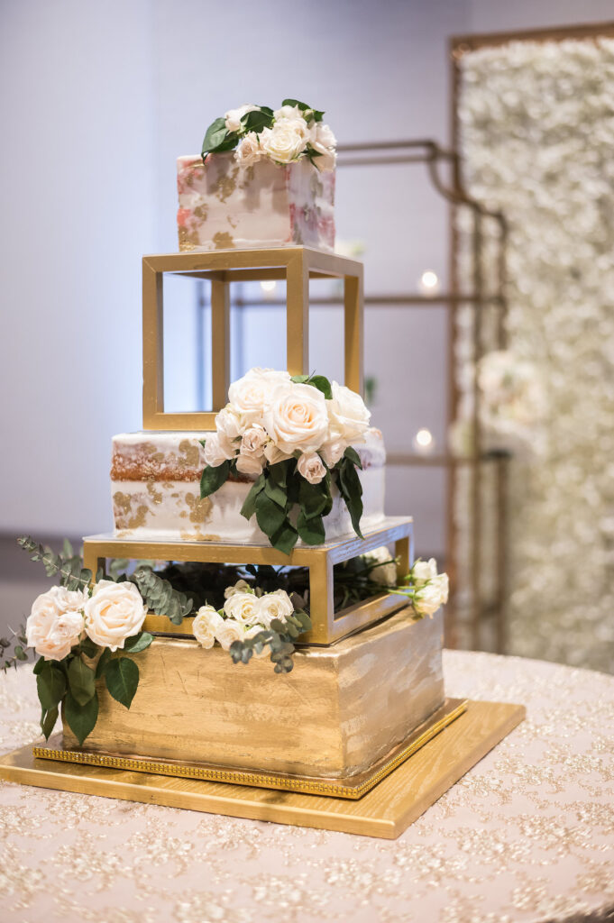 Dominique & Xavier Wiggins wed in a fabulous "A Night at the Oscars" themed wedding in downtown Memphis with black tie attire and gold decor.