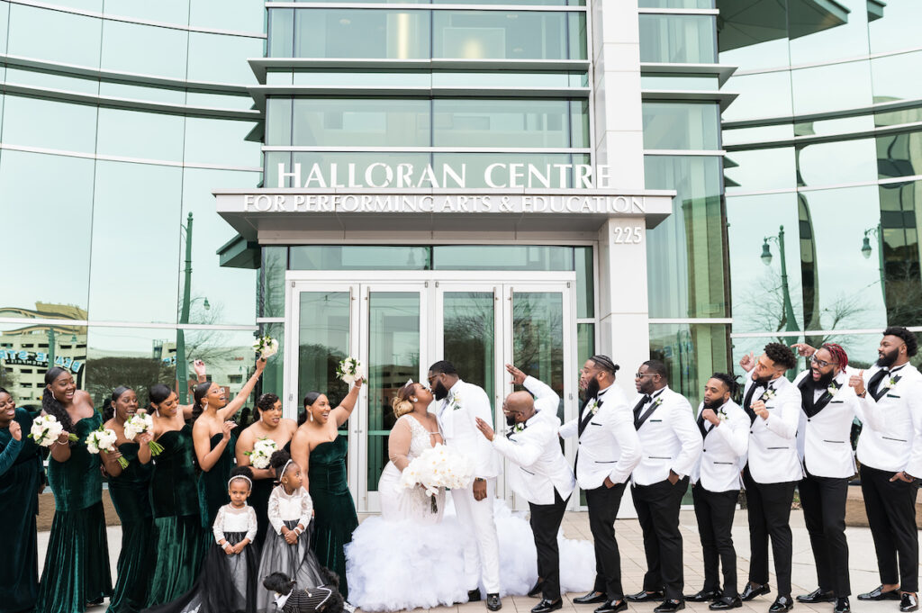 Dominique & Xavier Wiggins wed in a fabulous "A Night at the Oscars" themed wedding in downtown Memphis with black tie attire and gold decor.