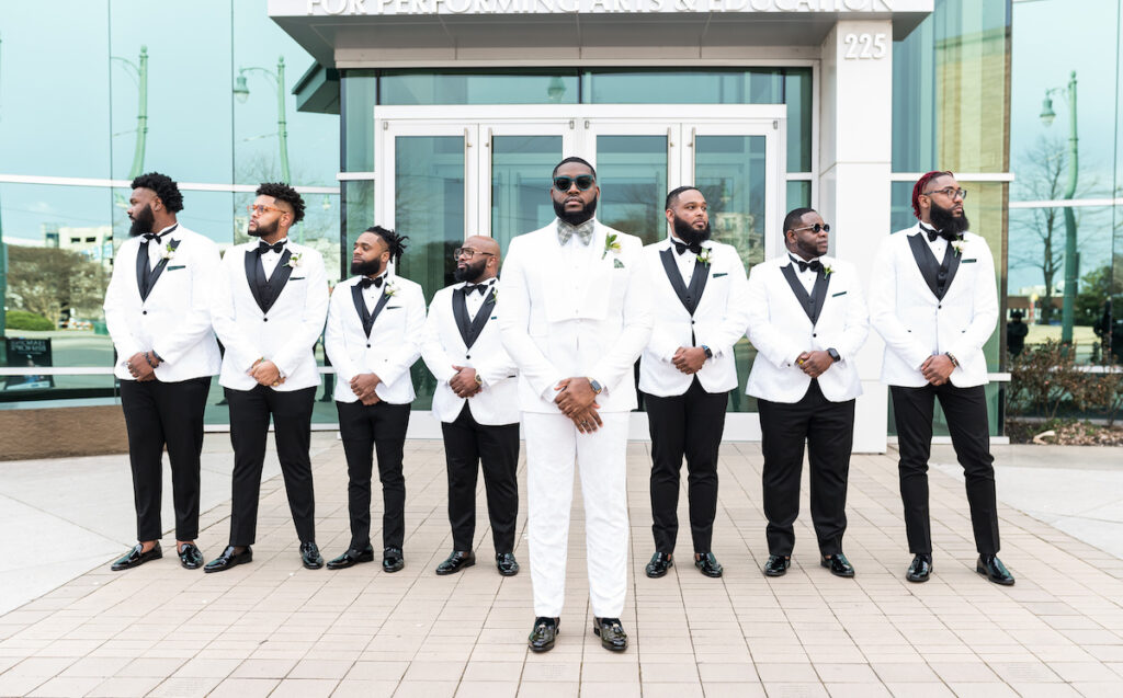 Dominique & Xavier Wiggins wed in a fabulous "A Night at the Oscars" themed wedding in downtown Memphis with black tie attire and gold decor.