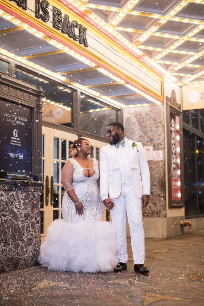 Dominique & Xavier Wiggins wed in a fabulous "A Night at the Oscars" themed wedding in downtown Memphis with black tie attire and gold decor.