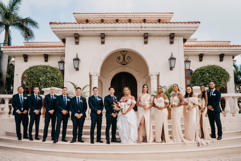 Beach waves and white sand welcomed guests to Alexis and Ronnie's summer outdoor destination wedding in Mexico.