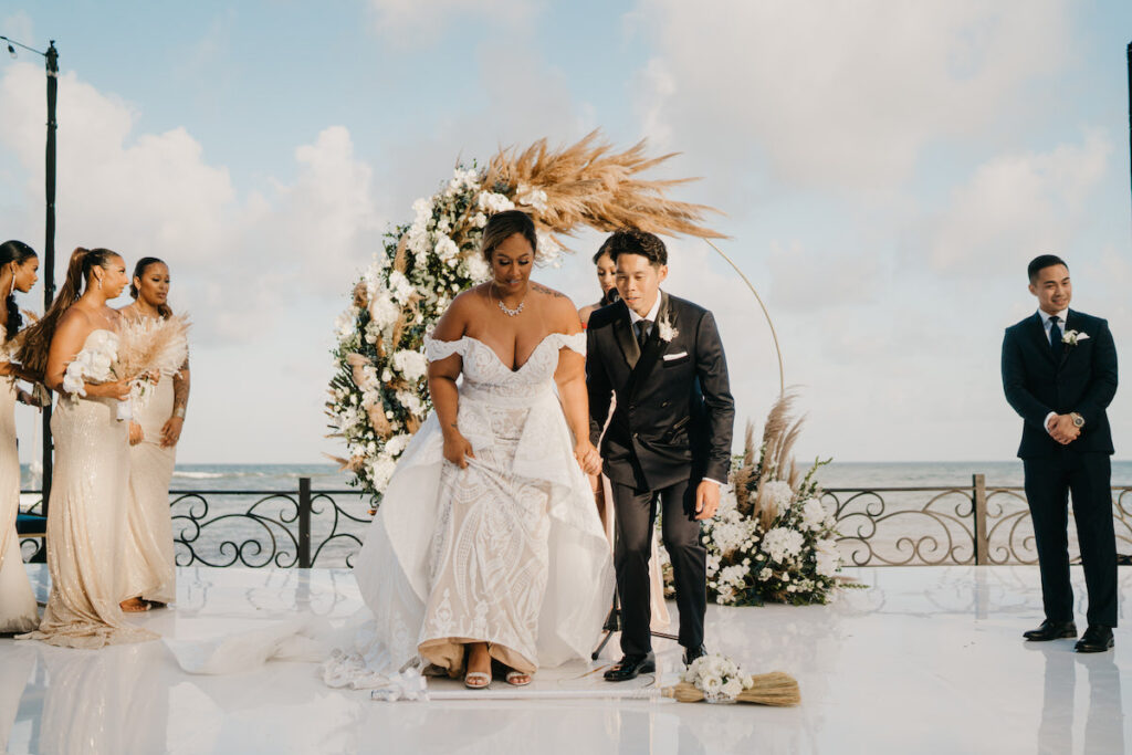 Beach waves and white sand welcomed guests to Alexis and Ronnie's summer outdoor destination wedding in Mexico.