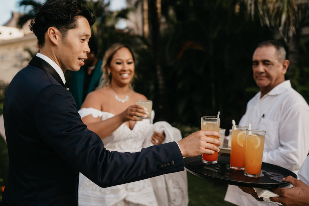 Beach waves and white sand welcomed guests to Alexis and Ronnie's summer outdoor destination wedding in Mexico.