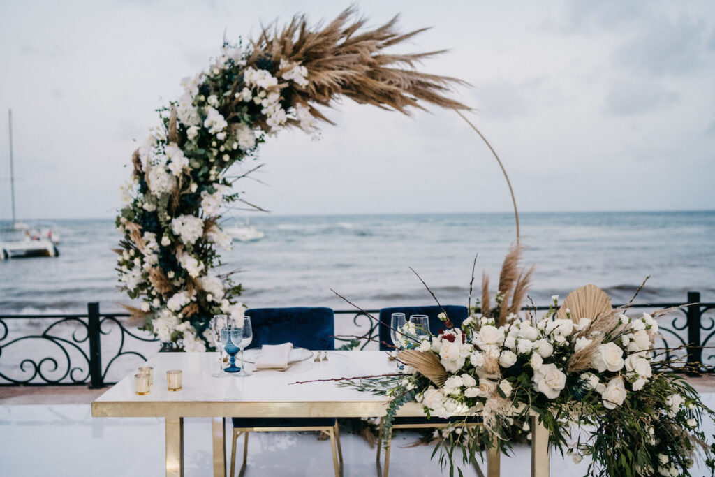 Beach waves and white sand welcomed guests to Alexis and Ronnie's summer outdoor destination wedding in Mexico.