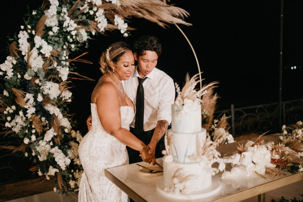 Beach waves and white sand welcomed guests to Alexis and Ronnie's summer outdoor destination wedding in Mexico.