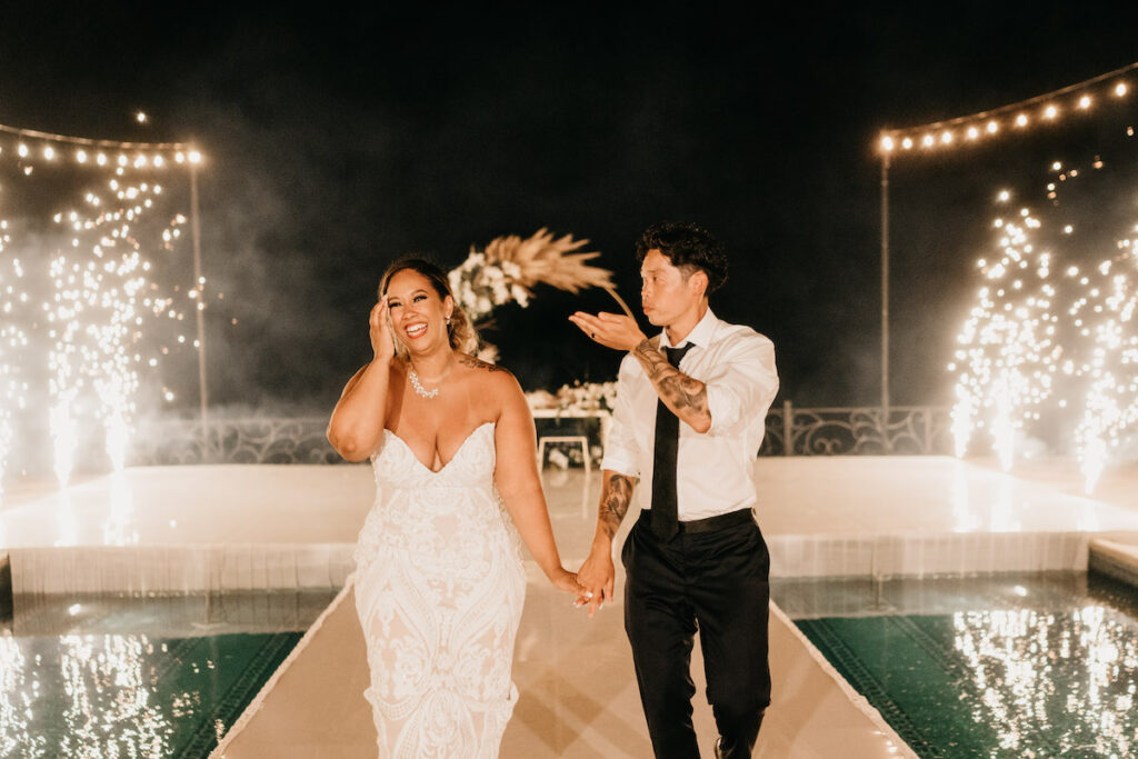 Beach waves and white sand welcomed guests to Alexis and Ronnie's summer outdoor destination wedding in Mexico.