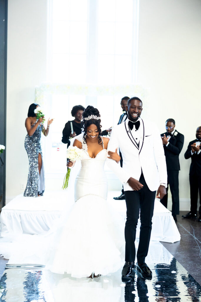 Amp & Asia's stunning black and white wedding at the 701 Whaley in Columbia, South Carolina, exudes classic elegance. 