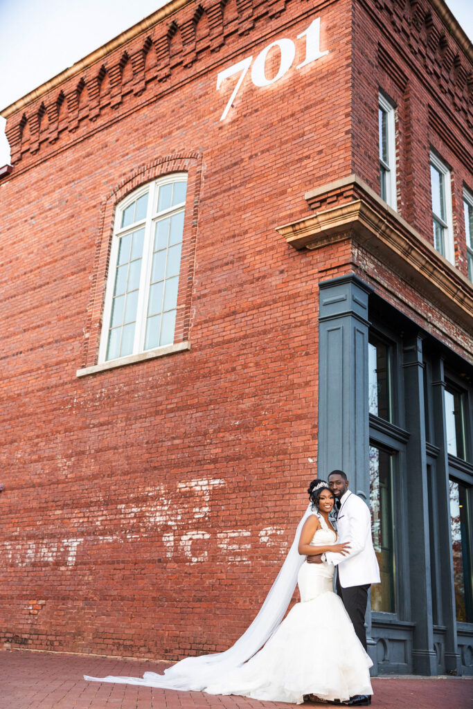 Amp & Asia's stunning black and white wedding at the 701 Whaley in Columbia, South Carolina, exudes classic elegance. 