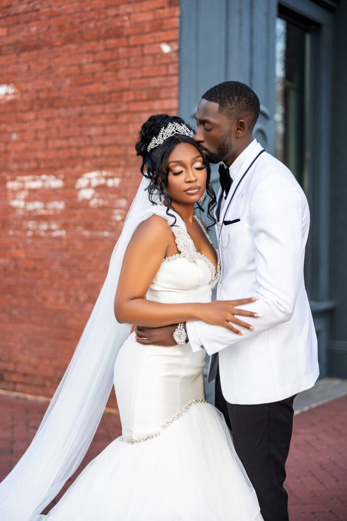 Amp & Asia's stunning black and white wedding at the 701 Whaley in Columbia, South Carolina, exudes classic elegance. 