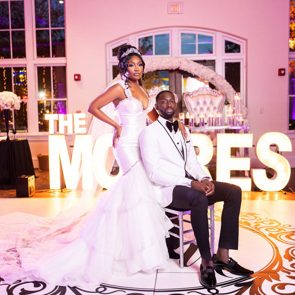 Amp & Asia's stunning black and white wedding at the 701 Whaley in Columbia, South Carolina, exudes classic elegance. 