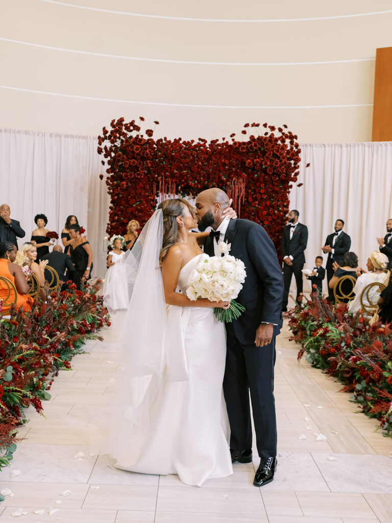 Featured in MunaLuchi Bride Magazine, Issue 28, red and pink florals bloom in this timeless wedding at the Atlanta History Center.