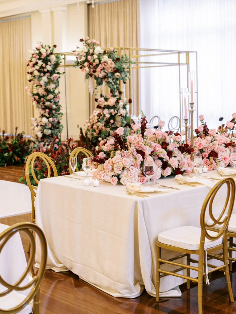 Featured in MunaLuchi Bride Magazine, Issue 28, red and pink florals bloom in this timeless wedding at the Atlanta History Center.