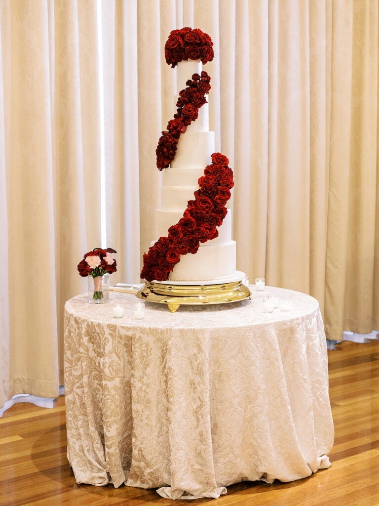 Featured in MunaLuchi Bride Magazine, Issue 28, red and pink florals bloom in this timeless wedding at the Atlanta History Center.