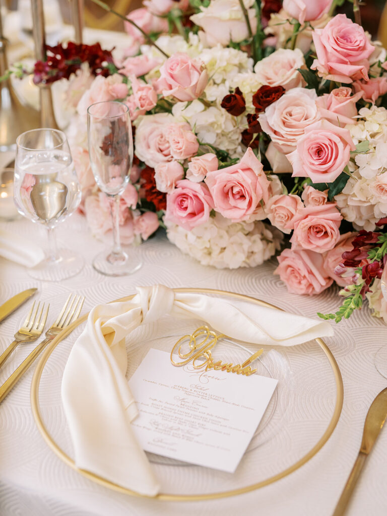 Featured in MunaLuchi Bride Magazine, Issue 28, red and pink florals bloom in this timeless wedding at the Atlanta History Center.