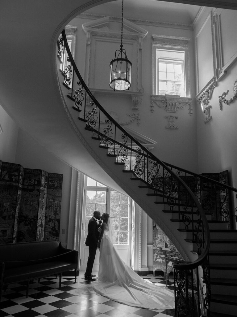 Featured in MunaLuchi Bride Magazine, Issue 28, red and pink florals bloom in this timeless wedding at the Atlanta History Center.