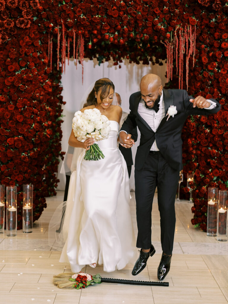 Featured in MunaLuchi Bride Magazine, Issue 28, red and pink florals bloom in this timeless wedding at the Atlanta History Center.