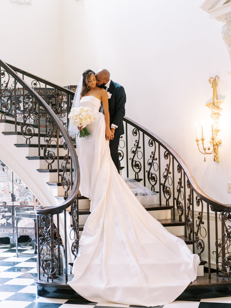 Featured in MunaLuchi Bride Magazine, Issue 28, red and pink florals bloom in this timeless wedding at the Atlanta History Center.