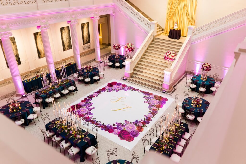 Indian nuptials features fuchsia florals, a sangeet pre-wedding party, and a stunning Hindu wedding ceremony at the New Orleans Museum of Art. 