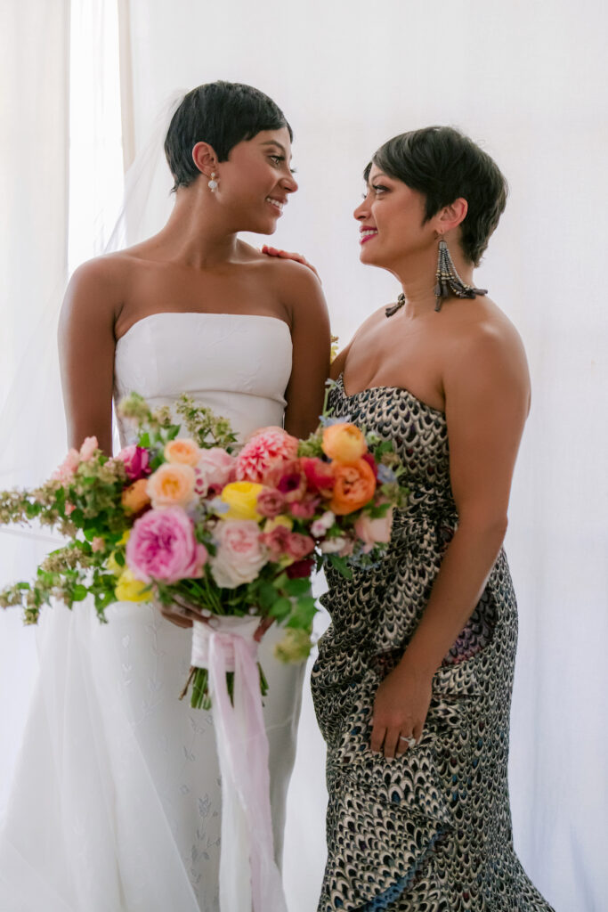 Bursting with colorful summer florals and sweet details, love blooms in this private estate wedding at the bride's grandmother's home in Walnut Creek, California.