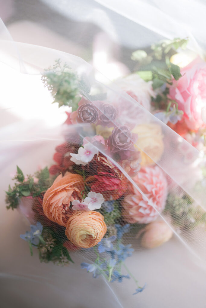 Bursting with colorful summer florals and sweet details, love blooms in this private estate wedding at the bride's grandmother's home in Walnut Creek, California.