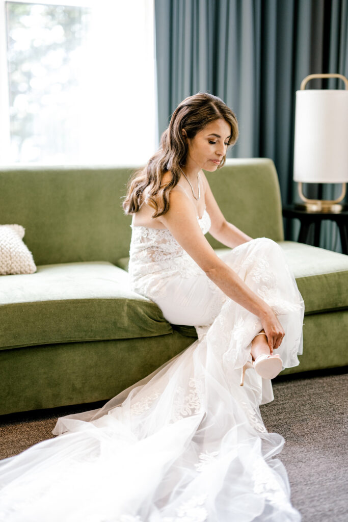 This waterfront wedding at the Tyee Yacht Club in Seattle, WA, features soft pink blooms, pops of red, and a bilingual English/Spanish ceremony.