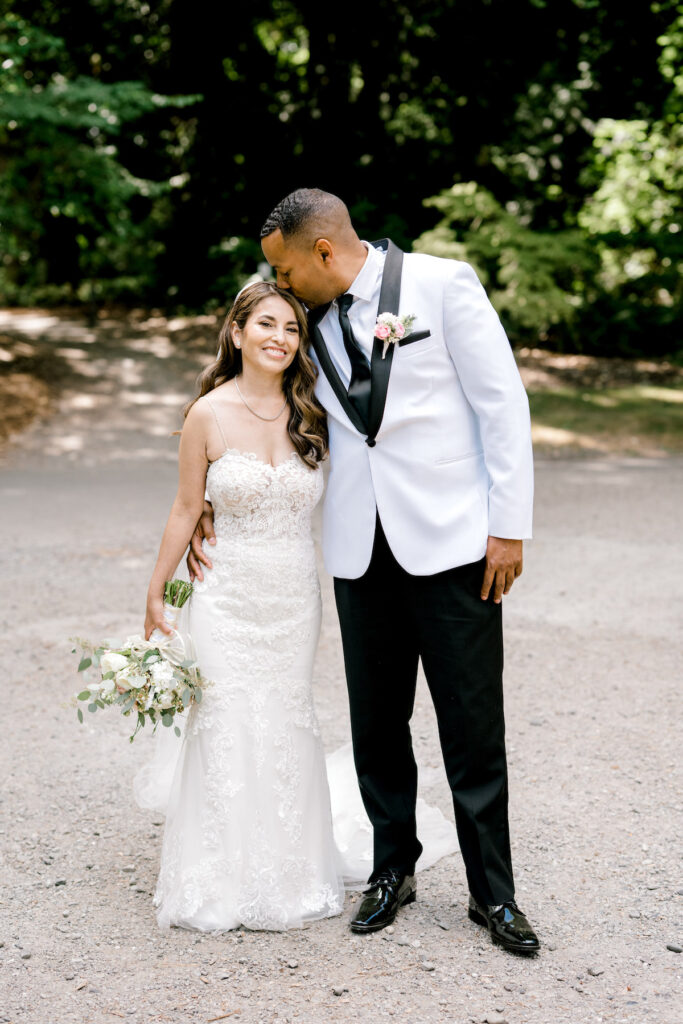 This waterfront wedding at the Tyee Yacht Club in Seattle, WA, features soft pink blooms, pops of red, and a bilingual English/Spanish ceremony.