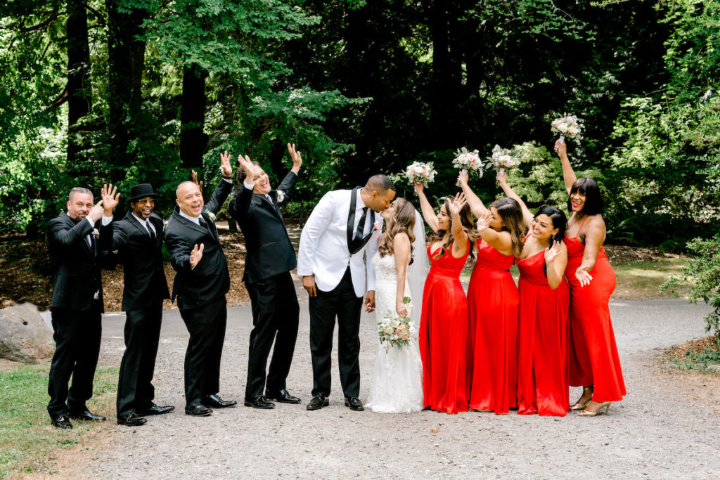 This waterfront wedding at the Tyee Yacht Club in Seattle, WA, features soft pink blooms, pops of red, and a bilingual English/Spanish ceremony.