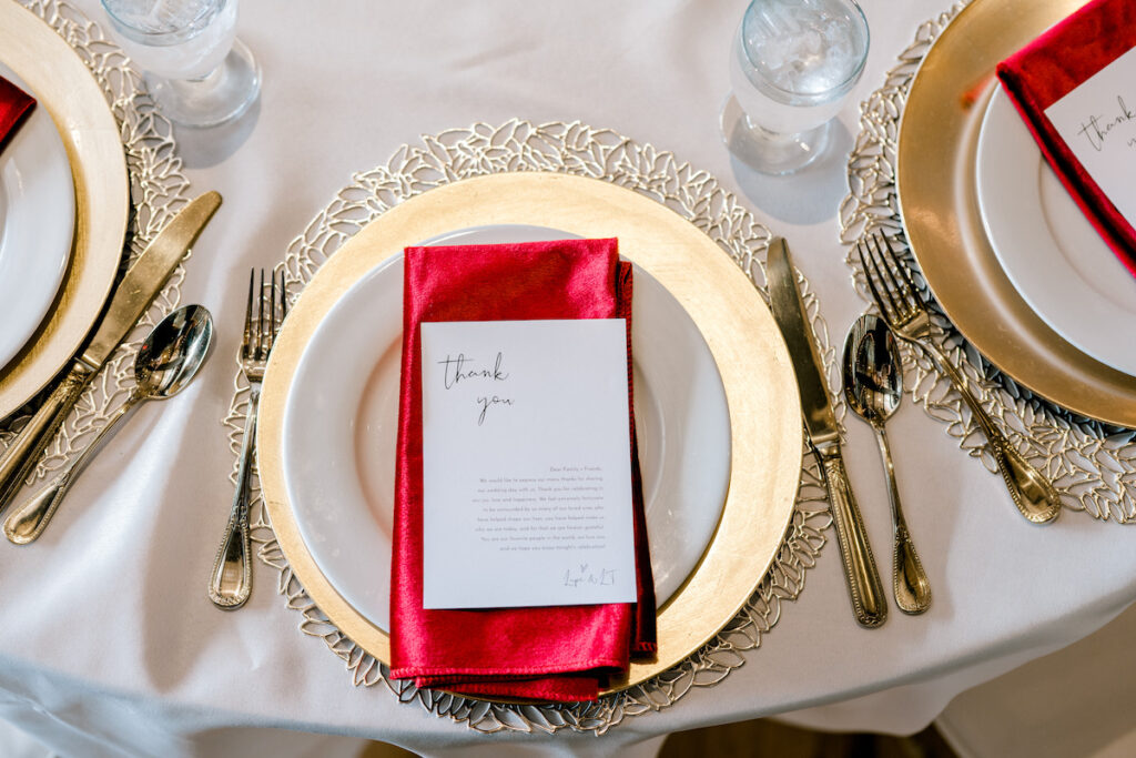 This waterfront wedding at the Tyee Yacht Club in Seattle, WA, features soft pink blooms, pops of red, and a bilingual English/Spanish ceremony.