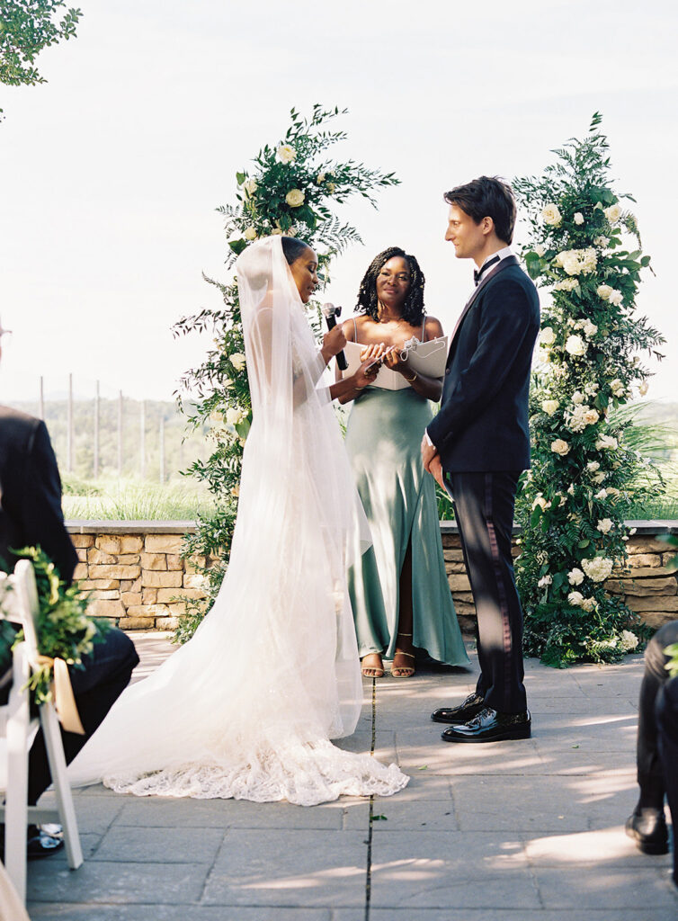 Attorneys say "I Do!" in a romantic outdoor ceremony at the Lansdowne Resort in Leesburg, VA. Featuring classy decor, gold details, and a gorgeous custom gown by Berta Bridal. 