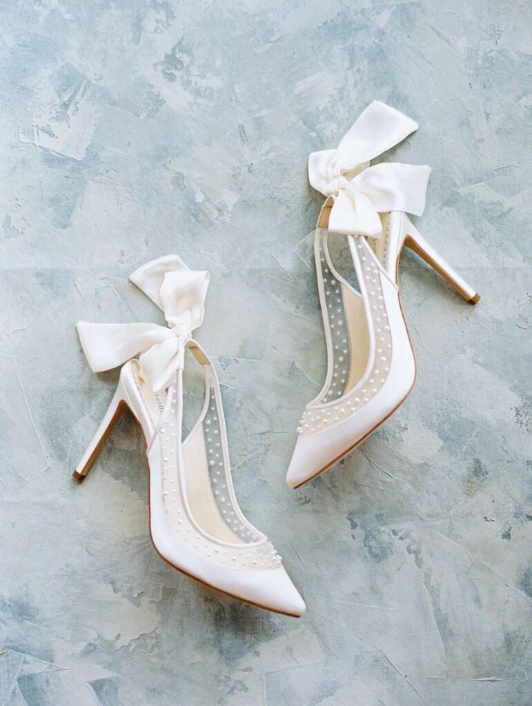 We've selected 19 standout summer bridal shoe styles that will surely bring extra glam and dazzle to your bridal style. | Gabrielle Ivory Slingback Wedding Shoes with Pearls