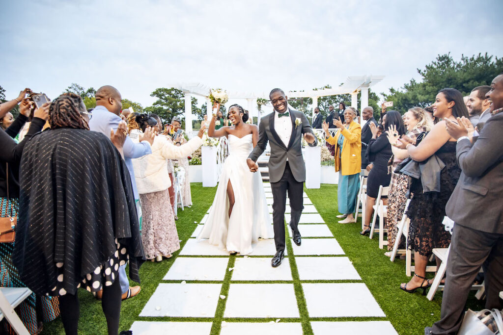 The bride's puff sleeve dress stars in this modern and elegant outdoor wedding ceremony at the VIP Country Club in New Rochelle, New York!